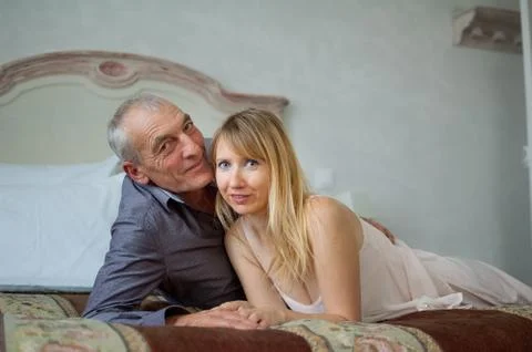 Portrait of Smiling Couple with Age Difference. Beautiful Young Woman with Her Stock Photos