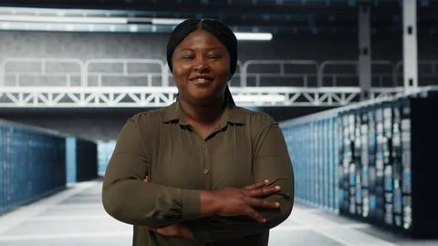 Portrait of smiling data center admin conducting security audit 스톡 사진
