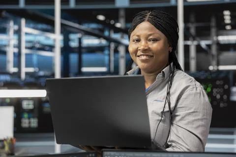 Portrait of smiling data center software developer using artificial intelligence Stock Photos