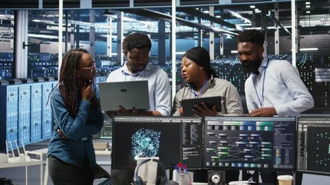 Portrait of smiling data center specialists collaborating in server facility Stock Footage 309110730