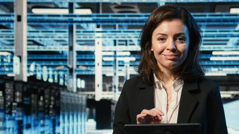 Portrait of smiling data center technician using AR control panel Stock Photos