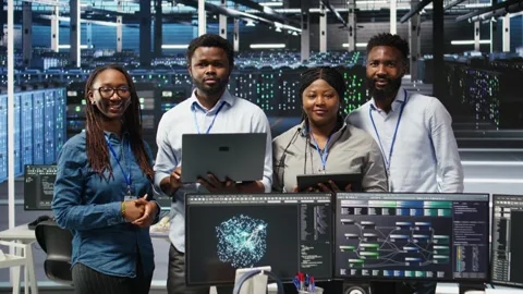 Portrait of smiling data center technicians analyze issues using node tree tool Stock Footage 309109631