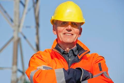 Portrait of a smiling engineer, foreman or worker with protective clothing an 写真素材