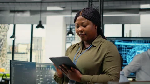 Portrait of smiling engineer working in office, using AI specialized hardware Video stock 323331718