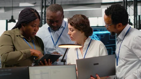 Portrait of smiling engineering team in office doing software development Stock Footage 323029275