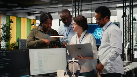 Portrait of smiling engineering team in office automating workflows using AI Stock Footage 323332024