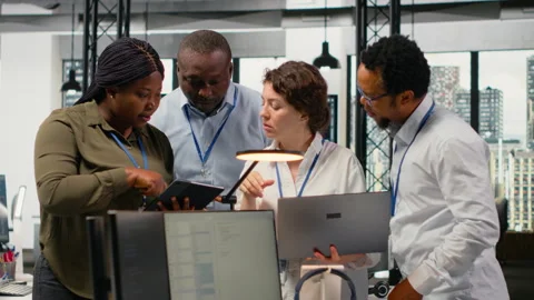 Portrait of smiling engineering team in office automating workflows using AI Stock Footage 323332130