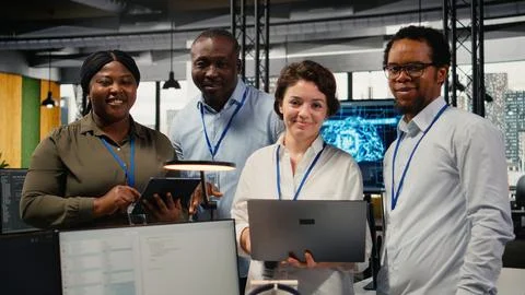 Portrait of smiling engineering team in office doing software development 스톡 사진