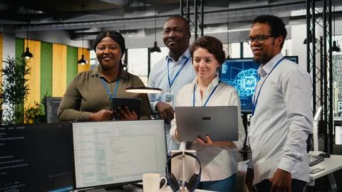 Portrait of smiling engineering team in office automating workflows using AI Stock Photos