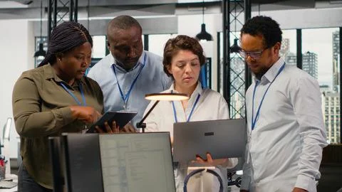 Portrait of smiling engineering team in office automating workflows using AI Stock Photos
