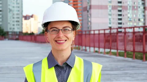 Portrait of a smiling female engineer in a construction helmet. Stock Footage 161070371