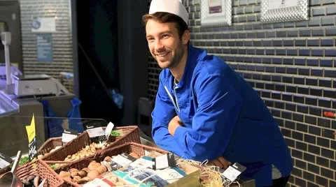 Portrait of smiling fishmonger in uniform Stock Footage 59861755