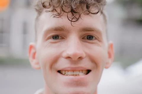 Portrait of a smiling guy with misaligned bite Stock Photos