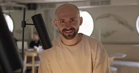 Portrait of smiling guy using laptop at cafe Stock Footage 159082355