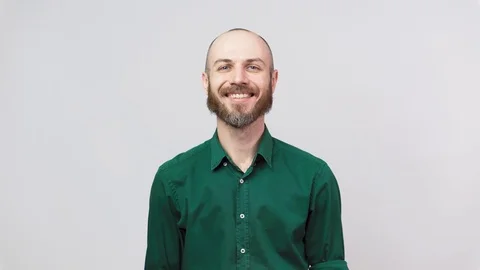 Portrait of a smiling handsome middle aged man over white background. Video stock 126663752