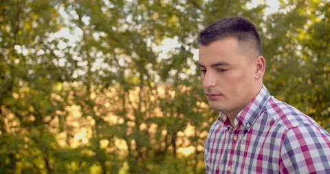 Portrait of a smiling handsome middle aged man in nature, slow motion. Concept Stock Footage 134165406