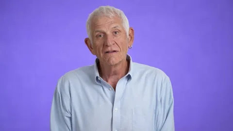 Portrait of a smiling handsome middle aged man 70s. Mature caucasian man showing Video stock 213263237