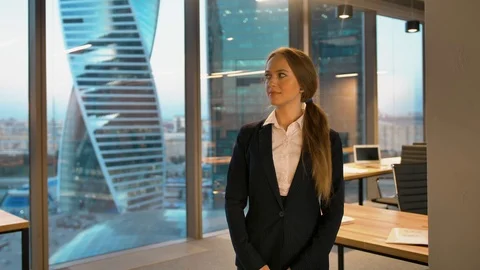 Portrait of smiling happy looking to camera businesswoman Stock Footage 104076456