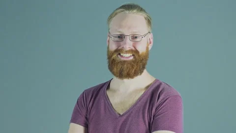 Portrait of smiling hipster red-haired man in glasses with trendy ginger beard Stock Footage 88351450
