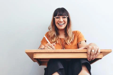 Portrait of a smiling illustrator at work Stock Photos