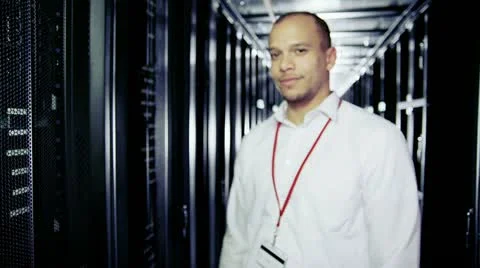 Portrait of a smiling IT engineer working in a data centre Stock Footage 22014467