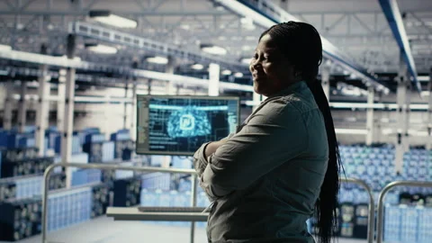 Portrait of smiling IT professional in server farm optimizing machine learning Stock Footage 314685644