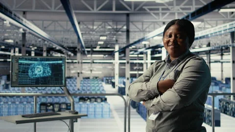 Portrait of smiling IT professional in server farm optimizing machine learning Stock Footage 314803630