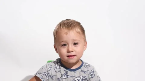 Portrait of smiling kid boy of 3 years on white background, happy child . Stock Footage 248764771