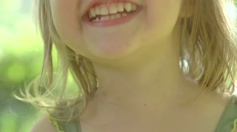 Portrait of a smiling little girl close up. Stock Footage 59089573