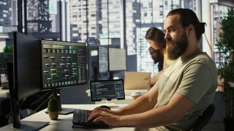 Portrait of smiling machine learning infrastructure engineer developing Stock Photos