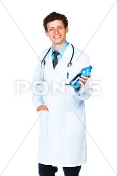 Portrait of a smiling male doctor holding bottle of water on white Stock Photos