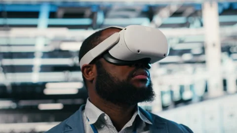 Portrait of smiling man in data center putting VR headset on Stock Footage 330029025