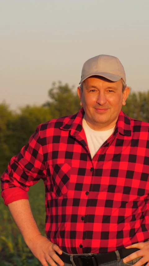 Portrait smiling man farmer posing at sunset sunny corn field countryside nature Stock Footage 300533662