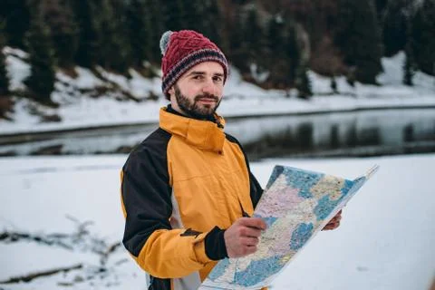 Portrait of smiling man in front of the camera , in the middle of landscape with Stock Photos