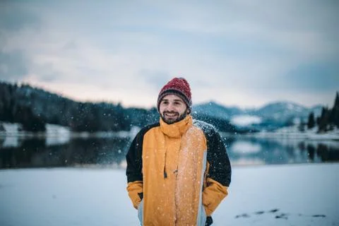 Portrait of smiling man in front of the camera , in the middle of landscape with Stock Photos