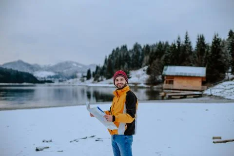 Portrait of smiling man in front of the camera , in the middle of landscape with Stock Photos