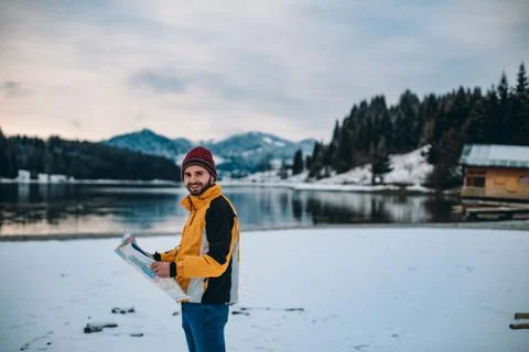 Portrait of smiling man in front of the camera , in the middle of landscape with Foto stock