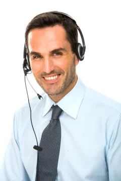 Portrait of a smiling man with headset working as a call center operator Stock Photos