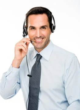 Portrait of a smiling man with headset working as a call center operator Stock Photos