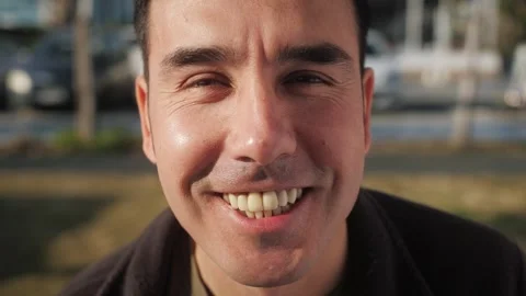 Portrait of smiling man looking at camera enjoying good day stroll in city. Stock-Footage 258332167