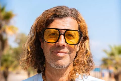 Portrait smiling man looking at camera outdoors. Stock Photos