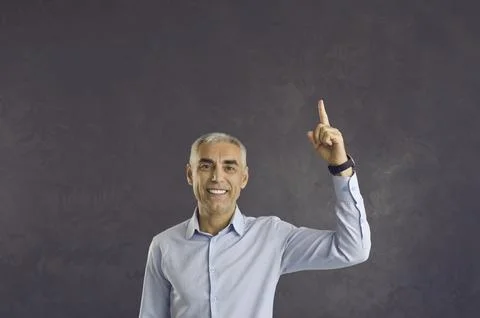 Portrait of smiling man point at empty copy space Stock Photos