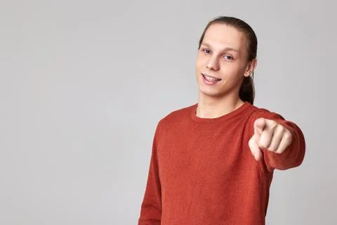 Portrait of smiling man pointing at camera 写真素材