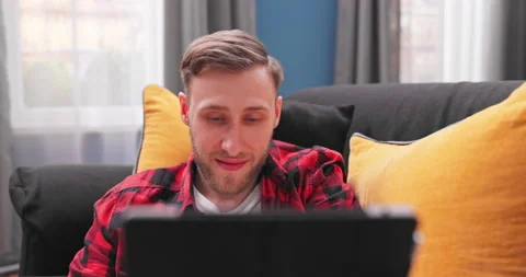 Portrait of smiling man using computer tablet, chatting online, making video Stock Footage 154054457