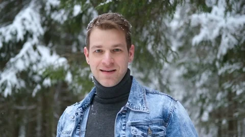 Portrait of a smiling man in a winter forest Stock Footage 147158449