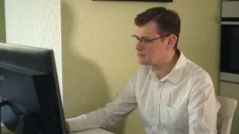 Portrait of smiling man working at home Stock Footage 86130699
