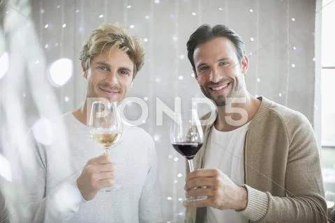 Portrait smiling men wine tasting Stock Photos