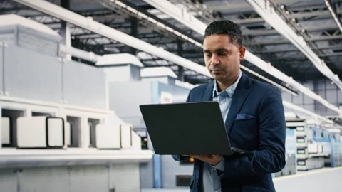 Portrait of smiling microchip factory manager using laptop to conduct study Stock Footage 333394812