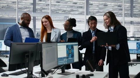 Portrait of smiling multiethnic engineering team optimizing PCB production Stock Footage 335880861
