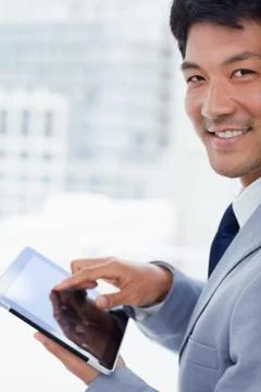 Portrait of a smiling office worker using a tablet computer Stock Photos